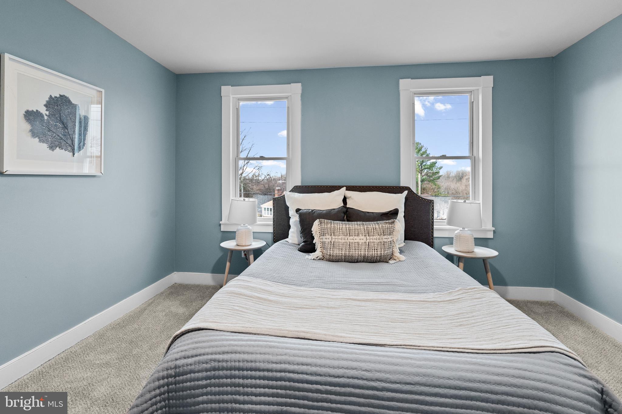 4604 Moravia Road Baltimore, MD 21206 - Photo 17 of 50 a bedroom with a bed and wooden floor