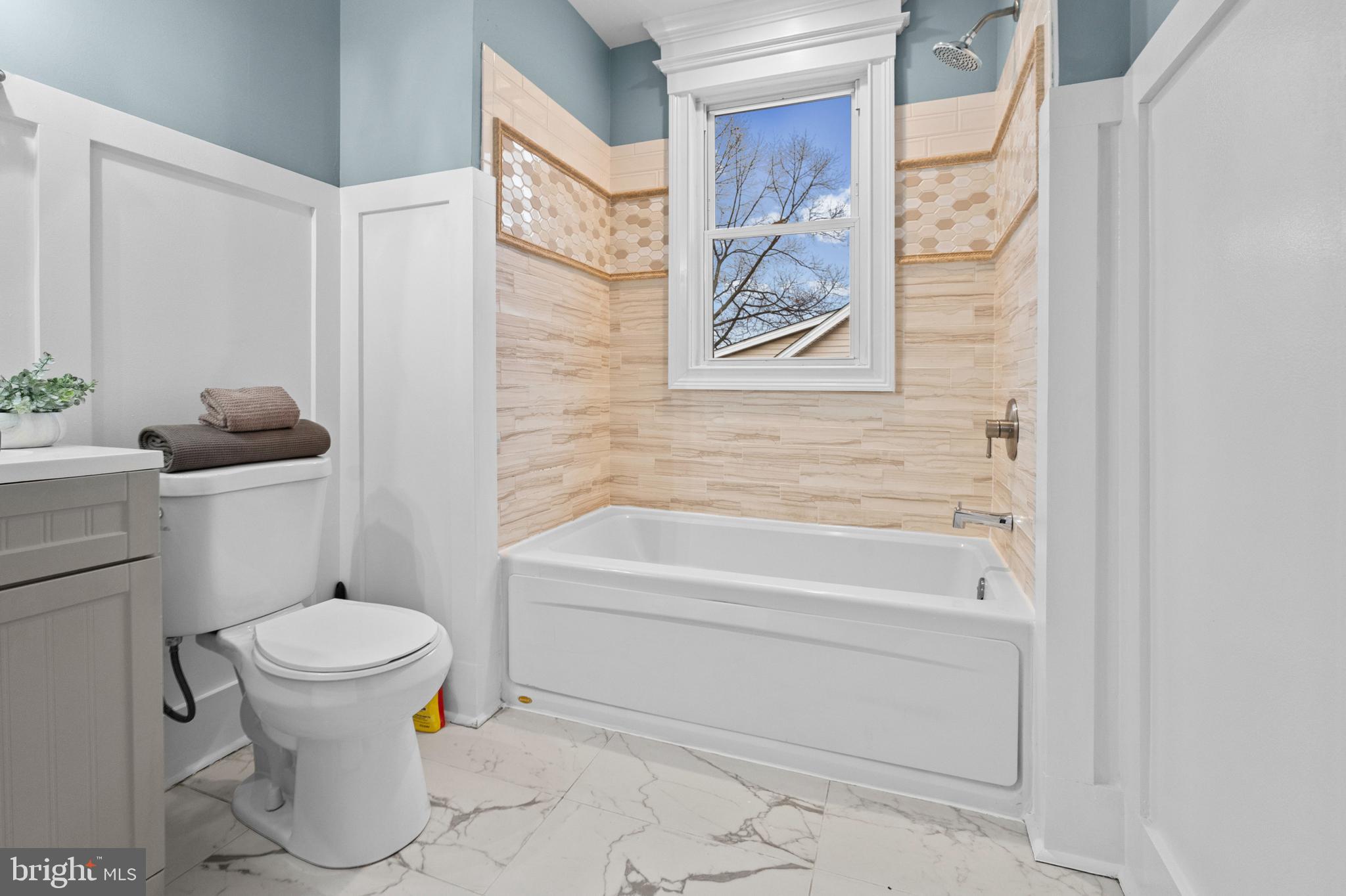 4604 Moravia Road Baltimore, MD 21206 - Photo 22 of 50 a bathroom with a toilet and a shower curtain