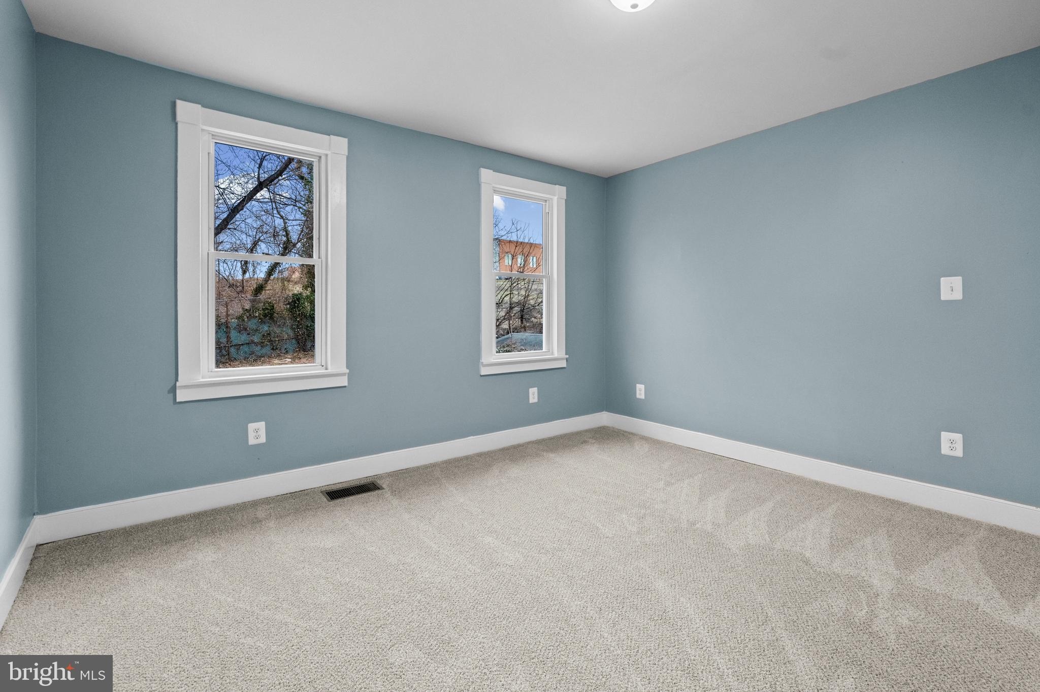 4604 Moravia Road Baltimore, MD 21206 - Photo 24 of 50 an empty room with windows and closet