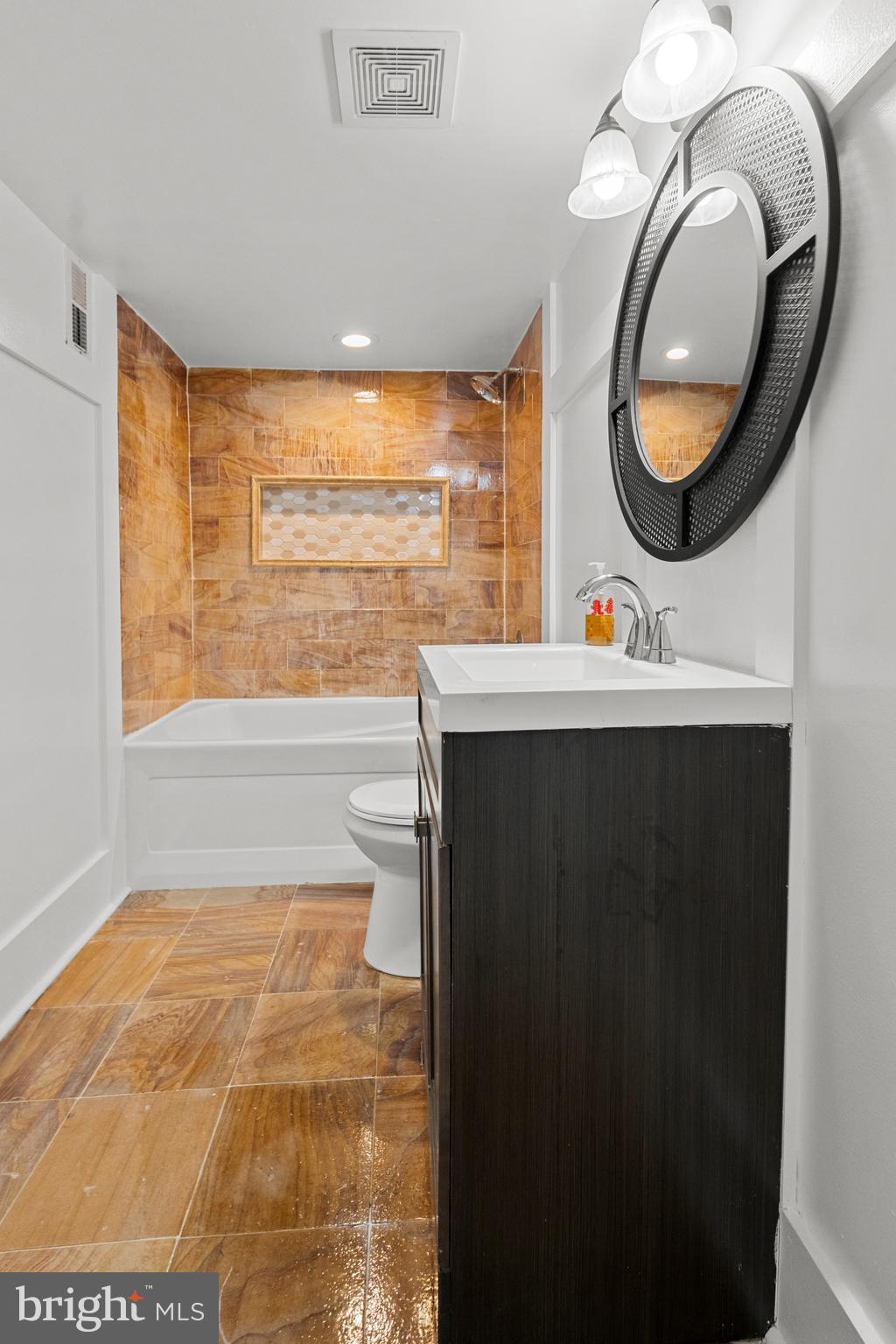 4604 Moravia Road Baltimore, MD 21206 - Photo 33 of 50 a bathroom with a sink and a mirror