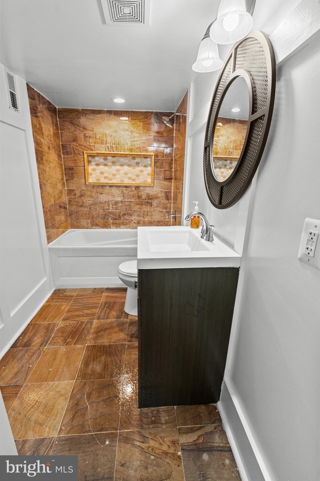 4604 Moravia Road Baltimore, MD 21206 - Photo 34 of 50 a bathroom with a sink and a mirror