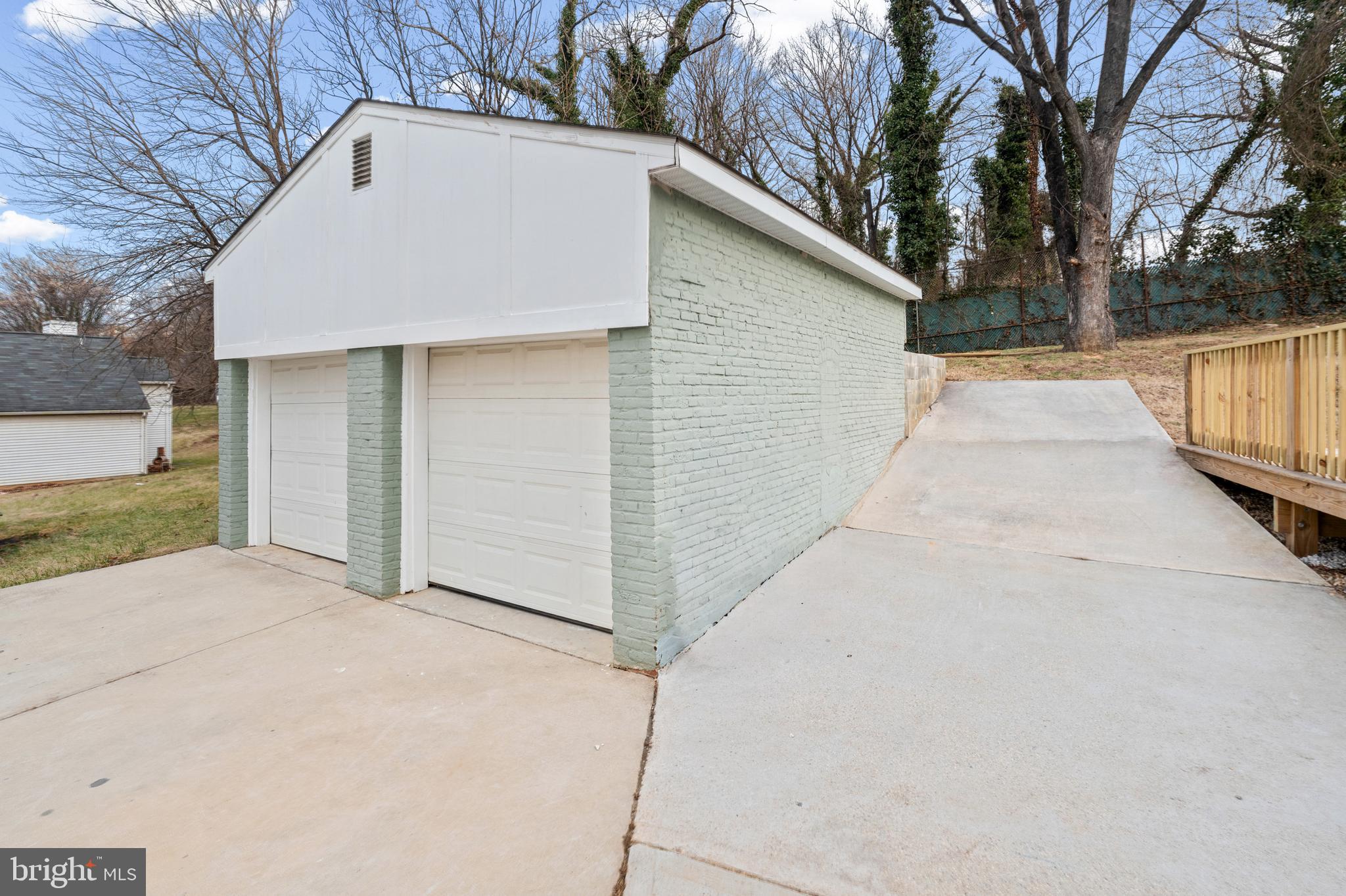 4604 Moravia Road Baltimore, MD 21206 - Photo 44 of 50 a view of a white house with a large tree