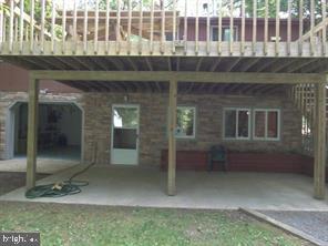 11890 Hilltop Road Lusby, MD 20657 - Photo 3 of 15 Lower level entrance, garage & covered patio