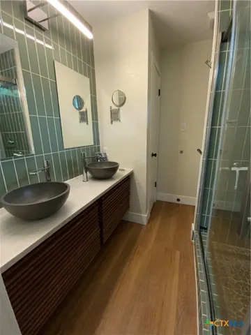 a bathroom with a sink and mirror