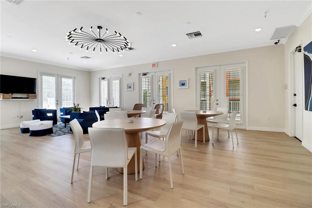 401 Bayfront Place, Unit 3502 Naples, FL 34102 - Photo 19 of 22 Dining room with french doors, ornamental molding, light wood finished floors, and recessed lighting
