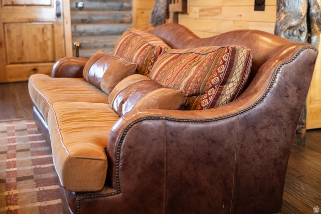 18906 North Canyon Road Whiterocks, UT 84085 - Photo 12 of 65 Living area featuring dark wood-style floors and rustic walls