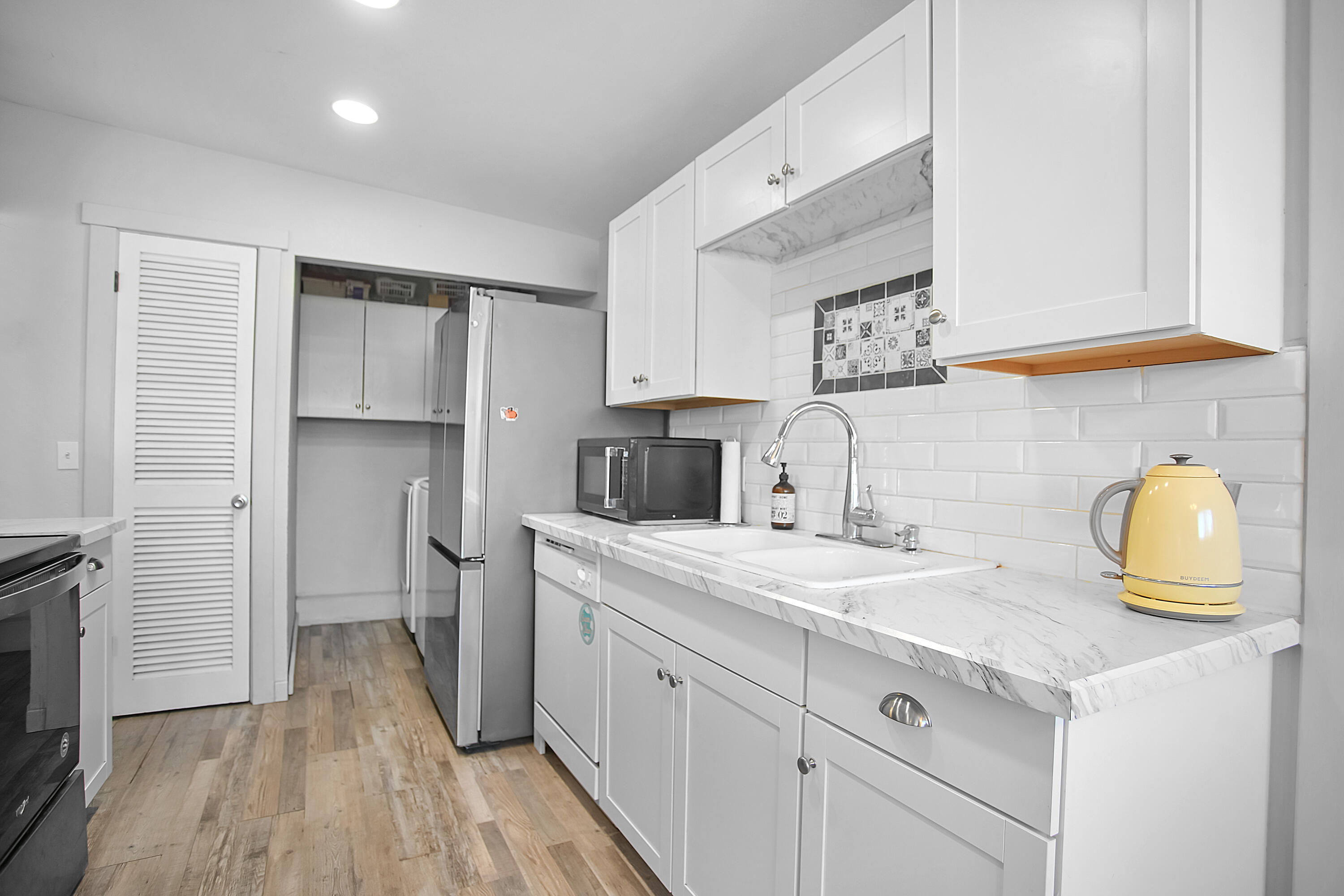 2519 62nd Street Lubbock, TX 79413 - Photo 12 of 30 a kitchen with a sink appliances and cabinets