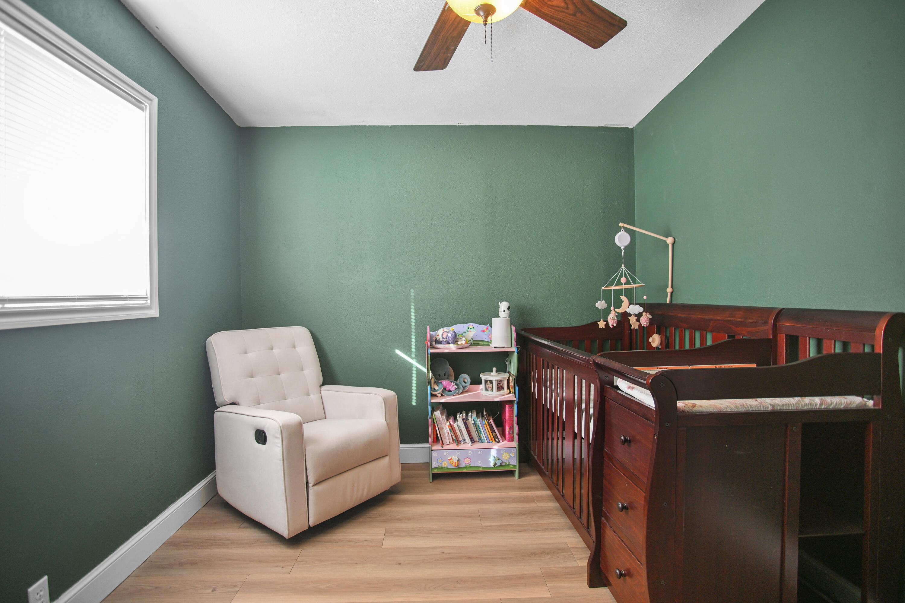 2519 62nd Street Lubbock, TX 79413 - Photo 21 of 30 a room with furniture and a wooden floor