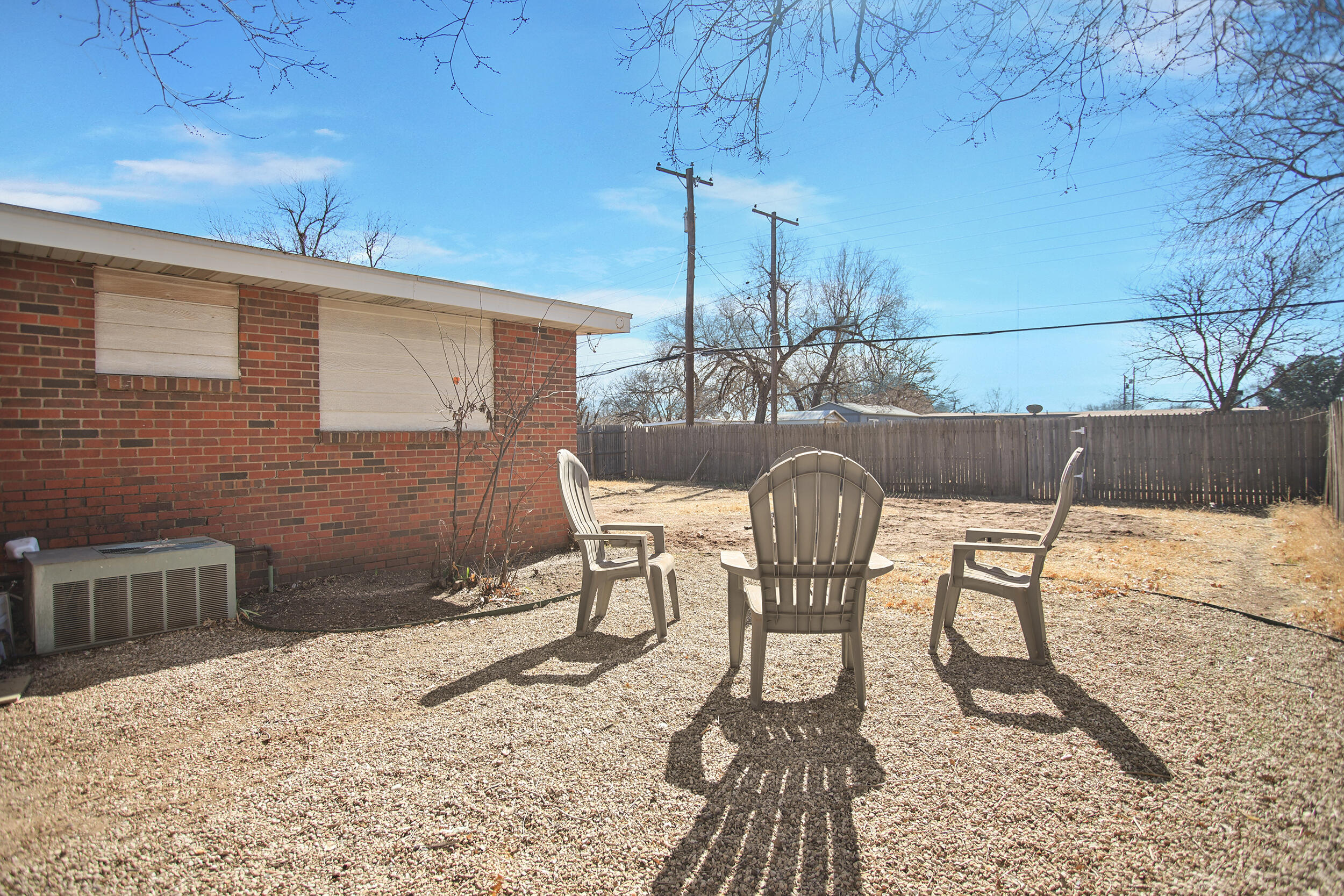 2519 62nd Street Lubbock, TX 79413 - Photo 25 of 30 a table and chairs in a patio