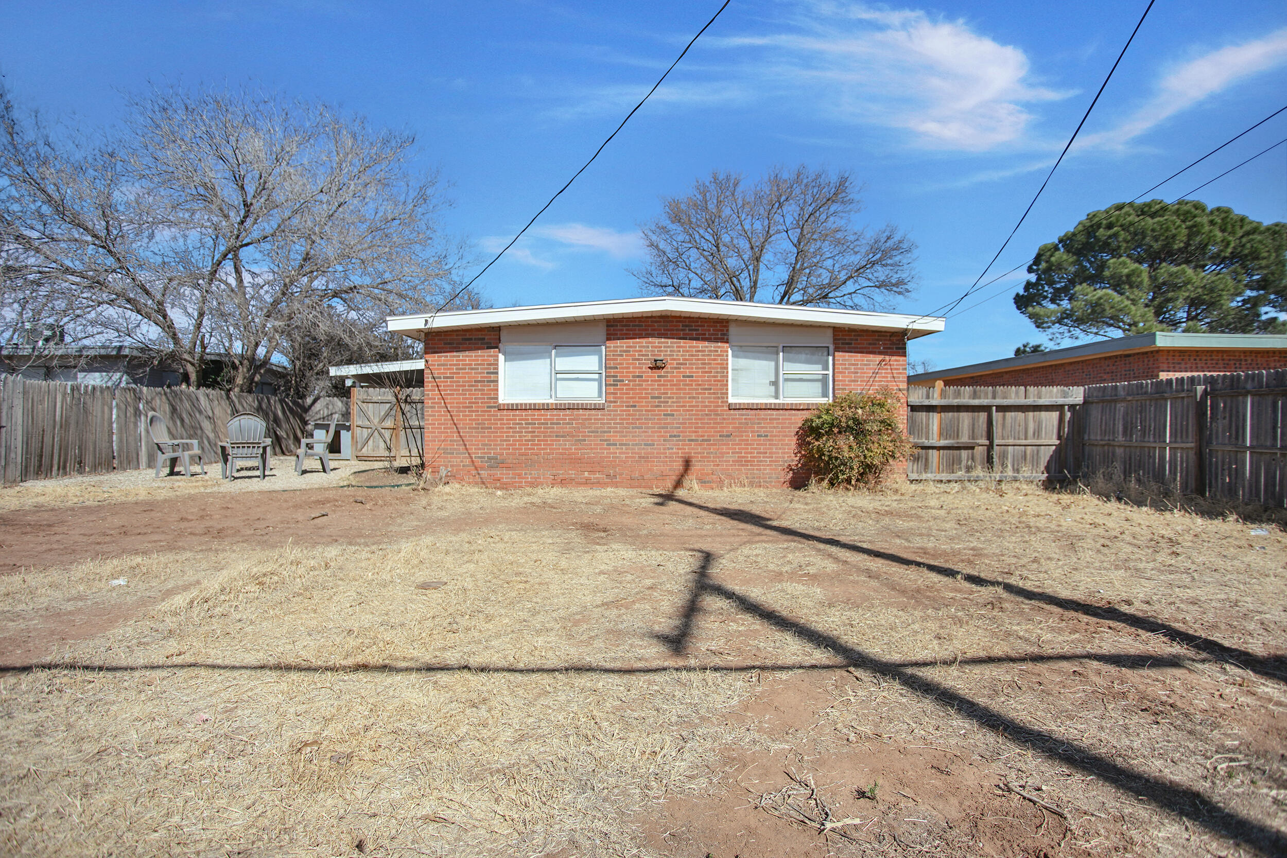 2519 62nd Street Lubbock, TX 79413 - Photo 27 of 30 a front view of a house with a yard