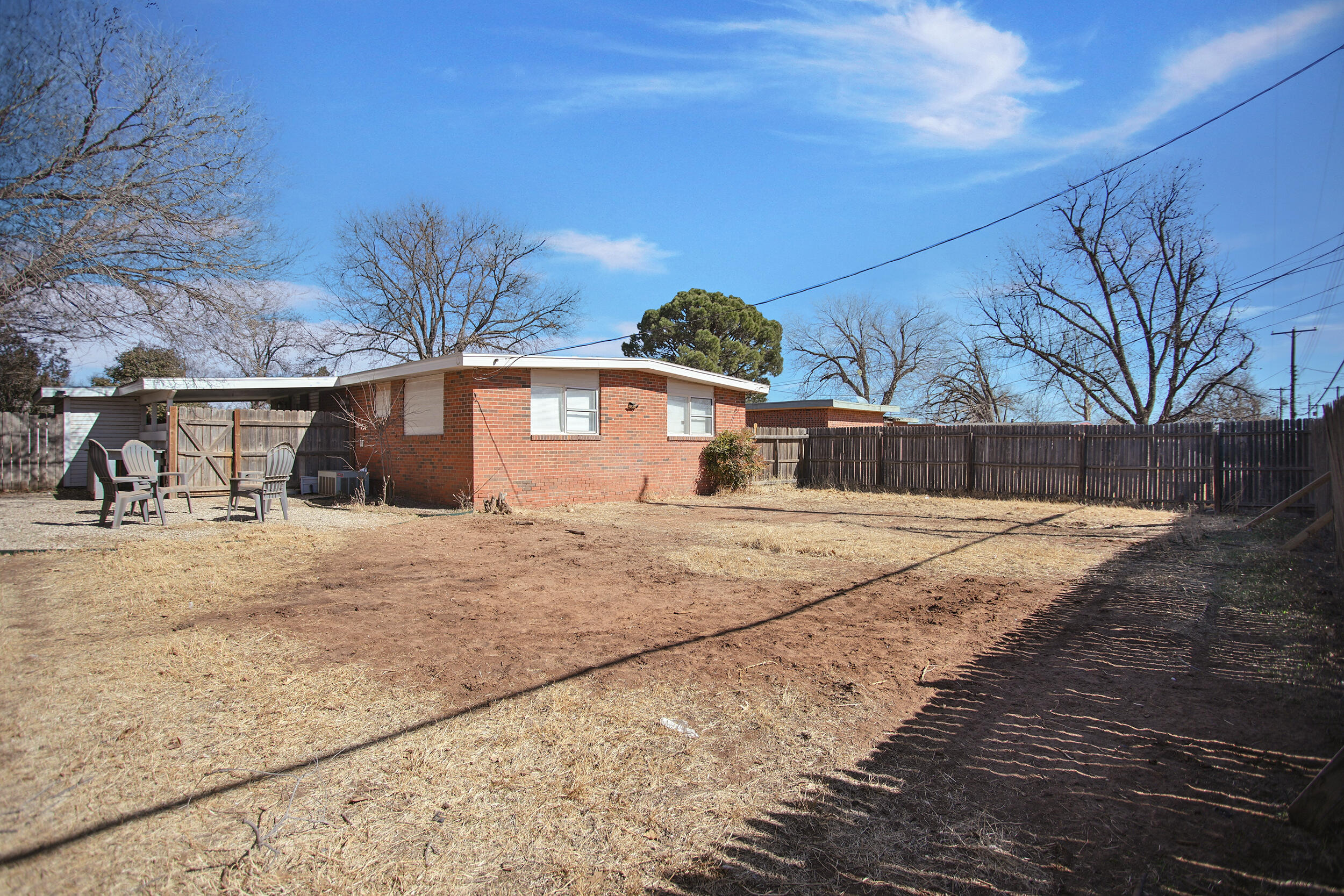 2519 62nd Street Lubbock, TX 79413 - Photo 28 of 30 a front view of a house with a yard
