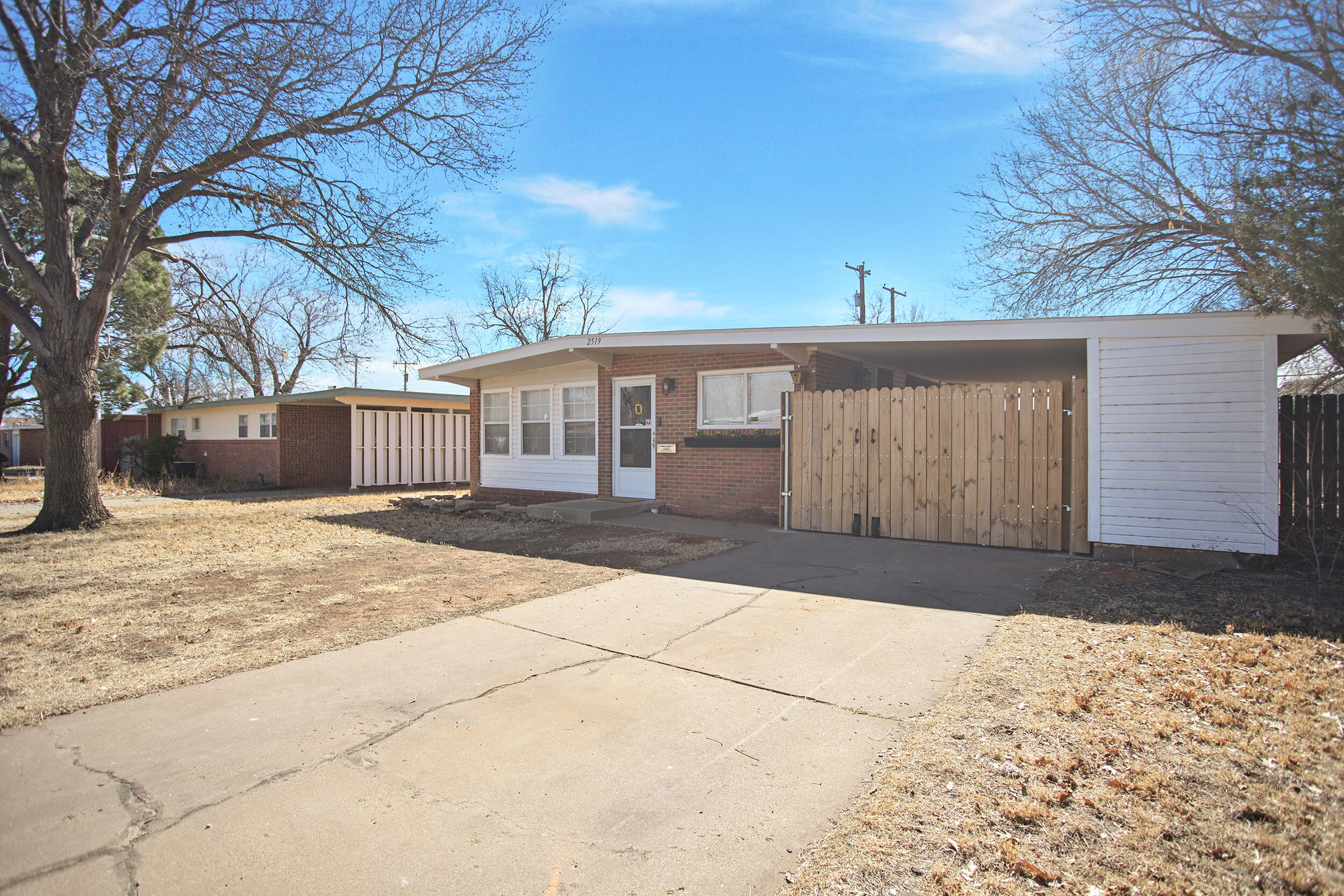 2519 62nd Street Lubbock, TX 79413 - Photo 3 of 30 a front view of a house with a yard