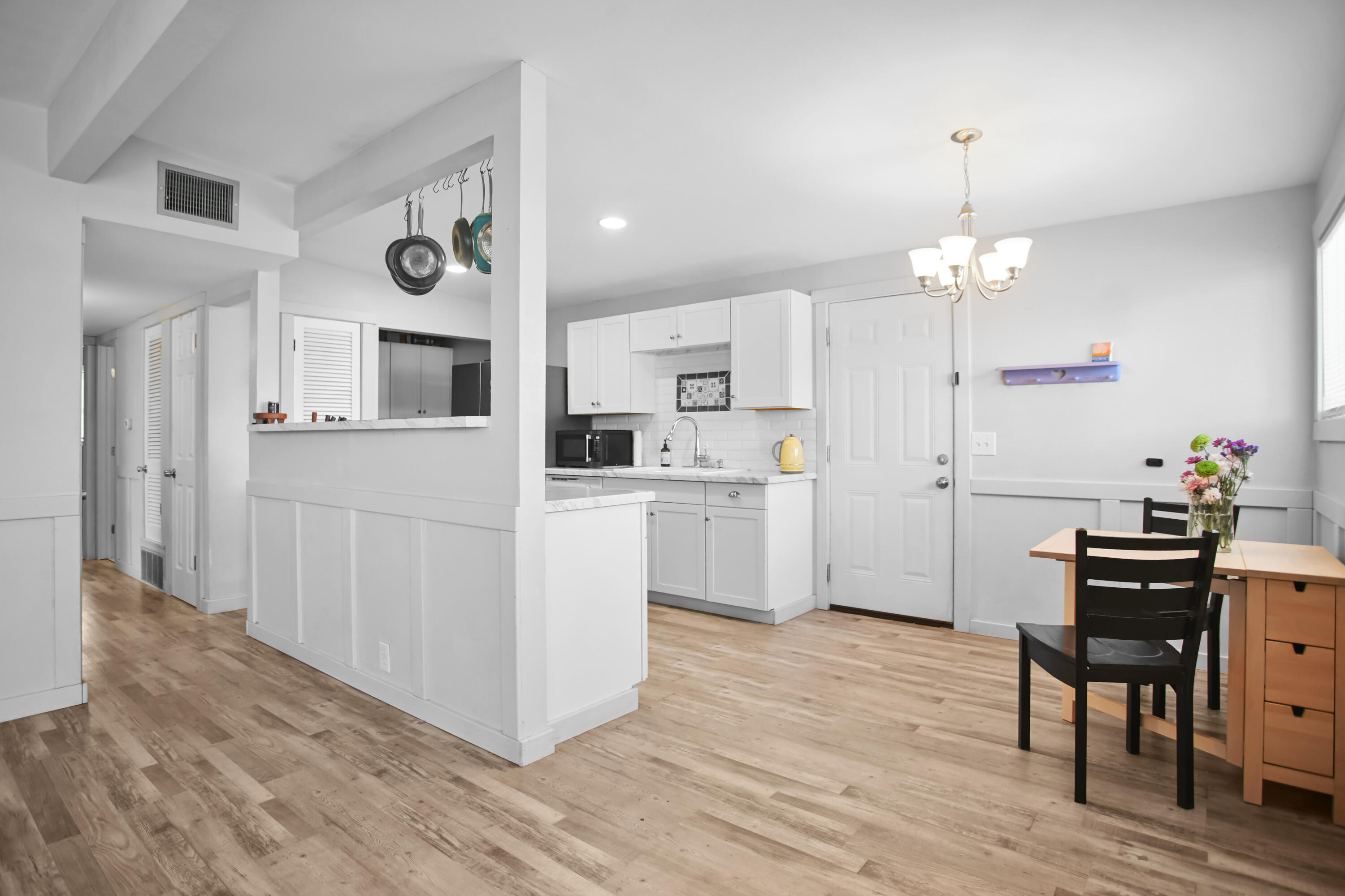 2519 62nd Street Lubbock, TX 79413 - Photo 7 of 30 a kitchen that has a lot of white cabinets and stainless steel appliances