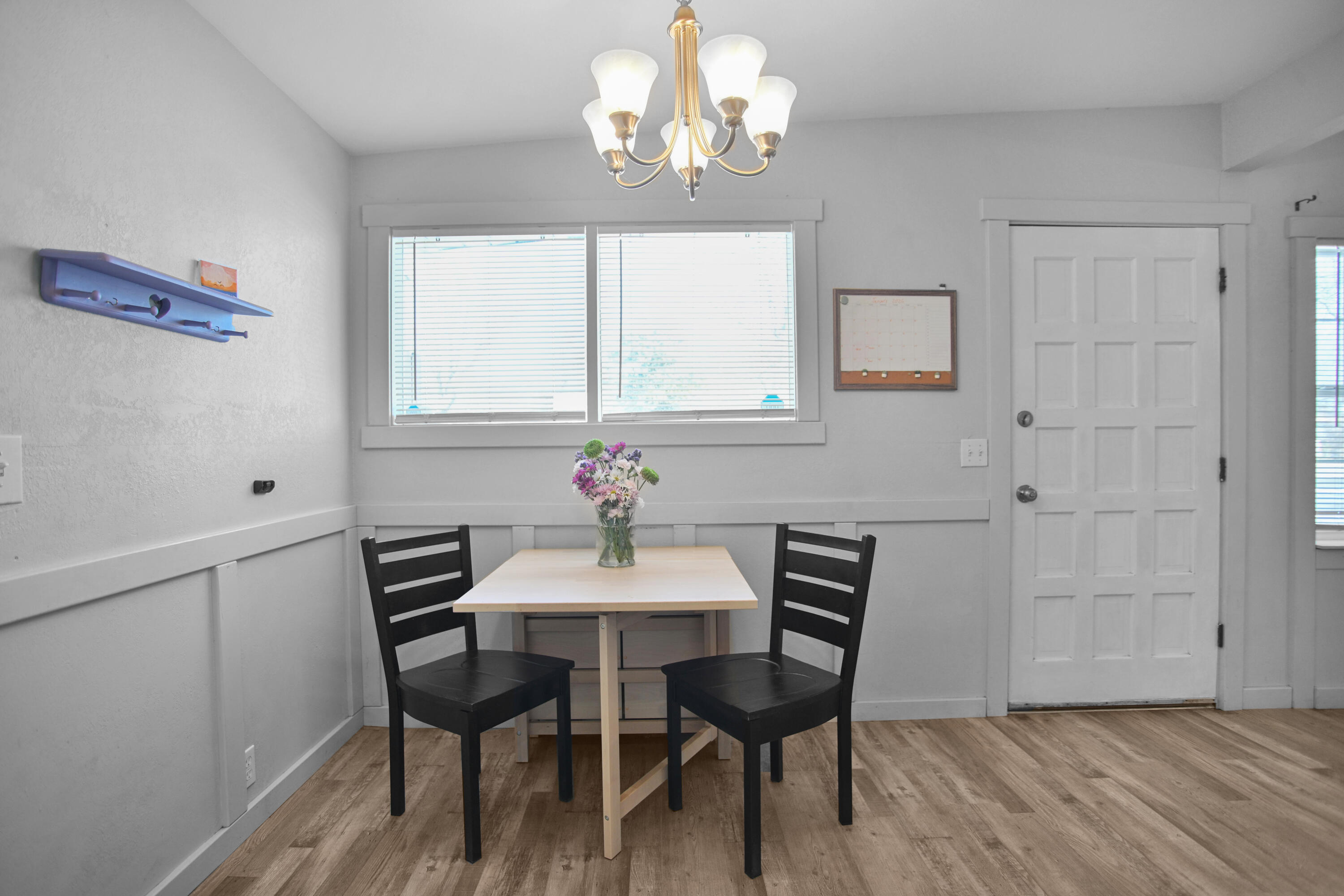 2519 62nd Street Lubbock, TX 79413 - Photo 10 of 30 a view of a dining room with furniture and wooden floor
