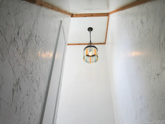 a view of door with wooden floor