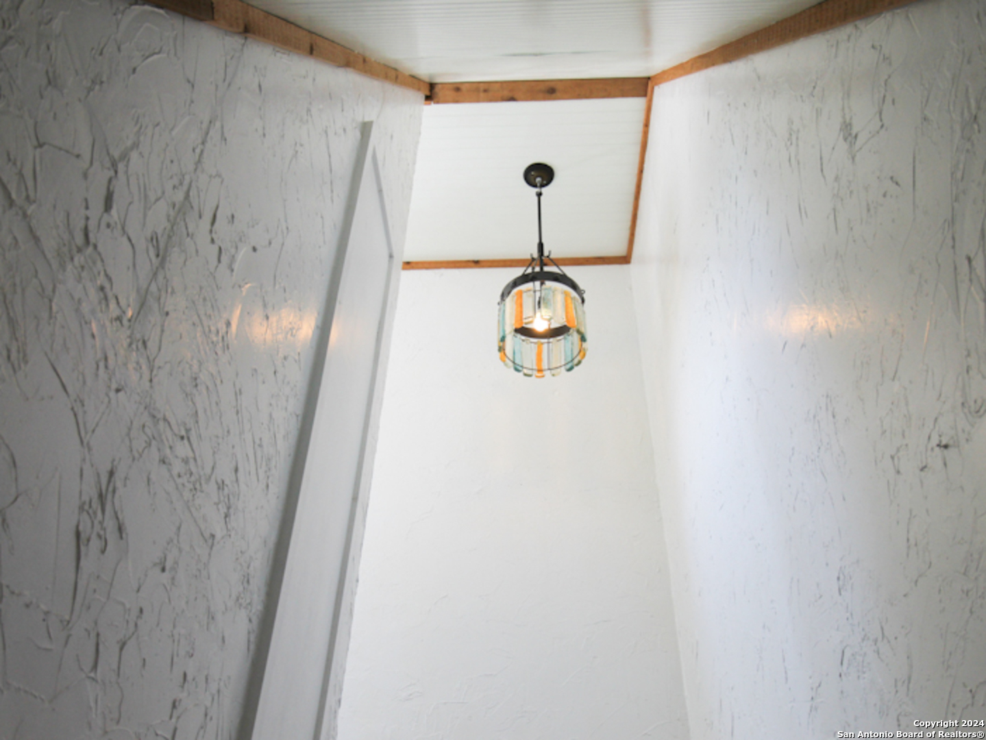 1468 Pebble Beach Road Lakehills, TX 78063 - Photo 15 of 23 a view of door with wooden floor