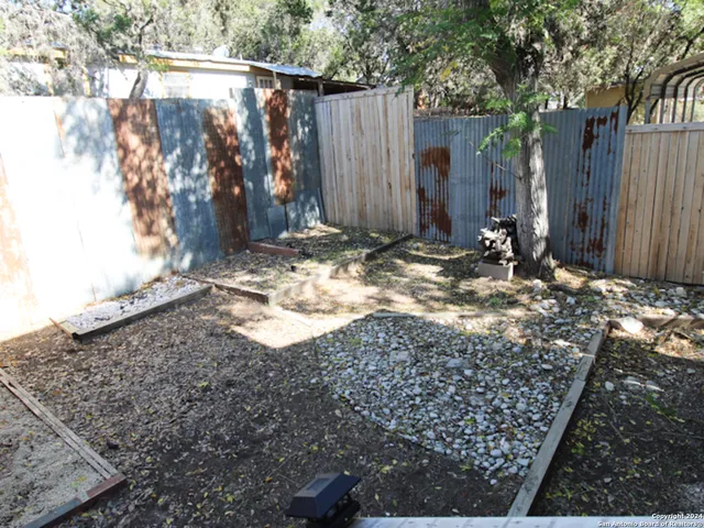a view of a backyard of the house