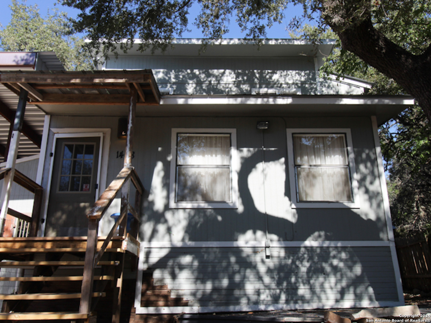 1468 Pebble Beach Road Lakehills, TX 78063 - Photo 5 of 23 a front view of a house with garden