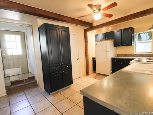 a view of a kitchen with a sink