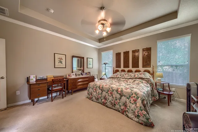 a bed room with a bed and a chandelier