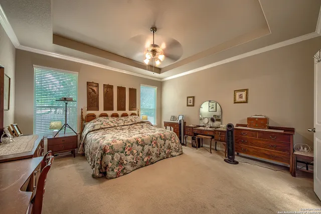 a bed room with furniture and a chandelier