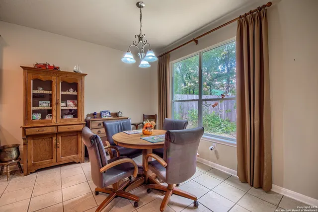 a view of a dining room with furniture window and outside view