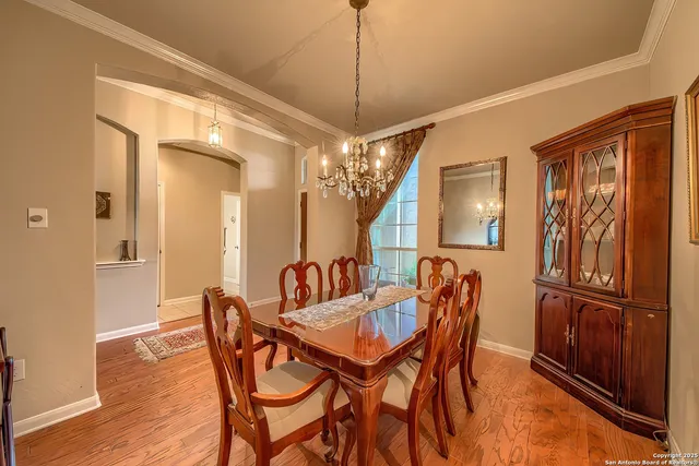 a dining room with furniture and window