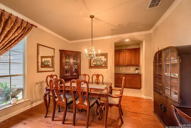 a dining room with furniture and window