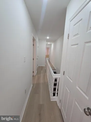 a view of a hallway with stairs