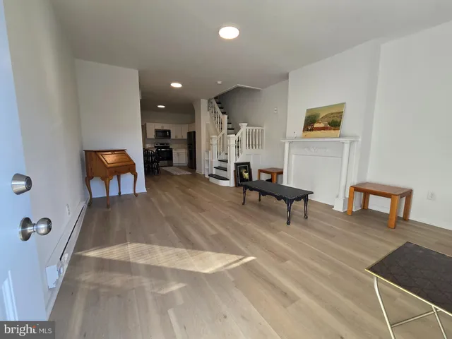 a living room with furniture and a table
