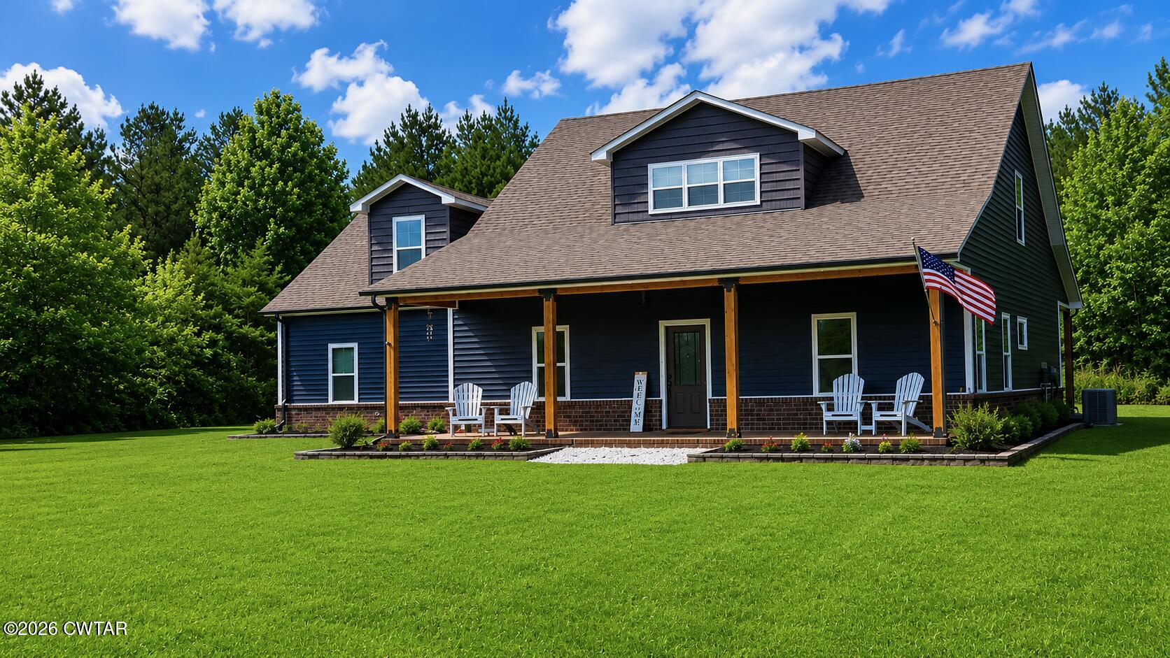 1586 Love Road Bells, TN 38006 - Photo 2 of 61 a front view of a house with a yard fire pit and outdoor seating