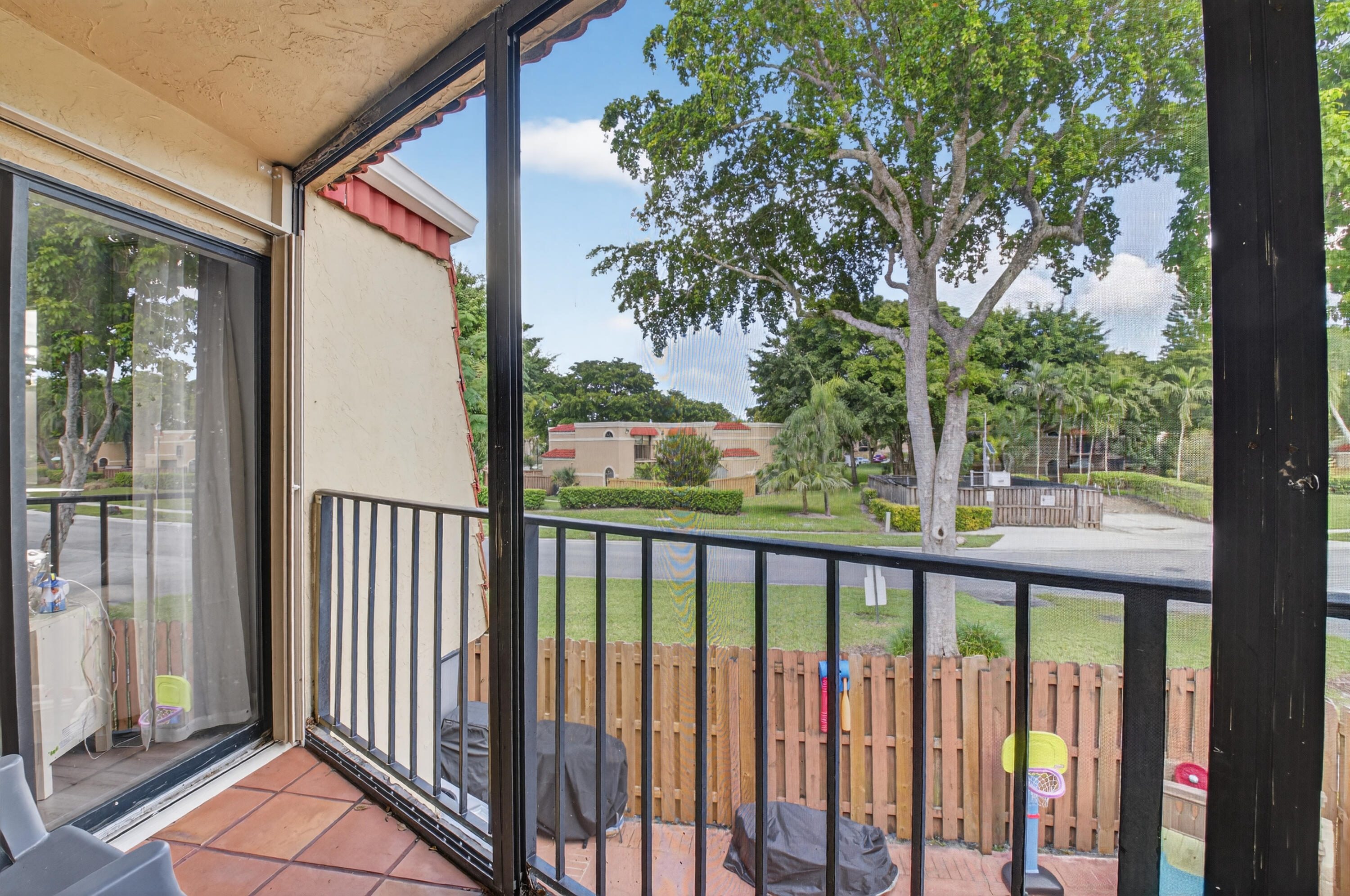 8200 Thames Boulevard, Unit C Boca Raton, FL 33433 - Photo 13 of 45 a view of a street from a balcony