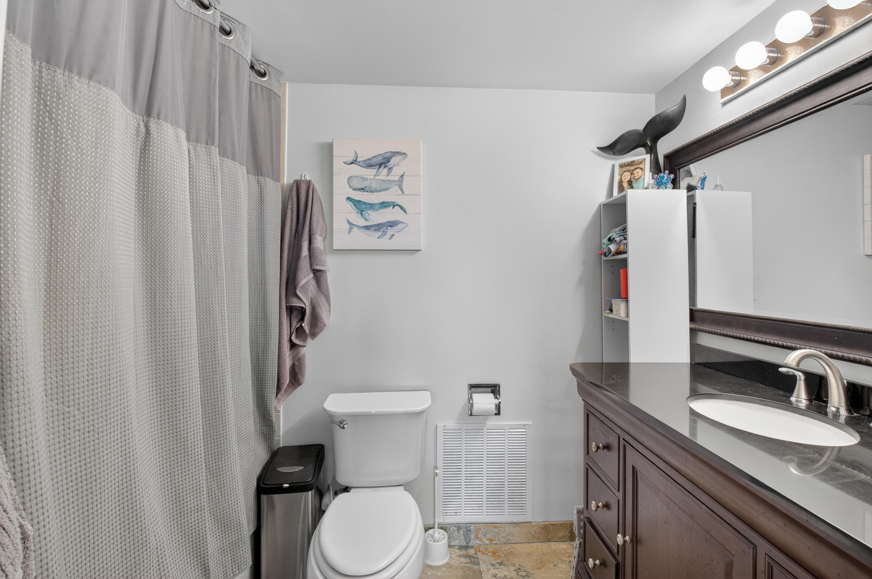 8200 Thames Boulevard, Unit C Boca Raton, FL 33433 - Photo 16 of 45 a bathroom with a granite countertop sink toilet and a mirror