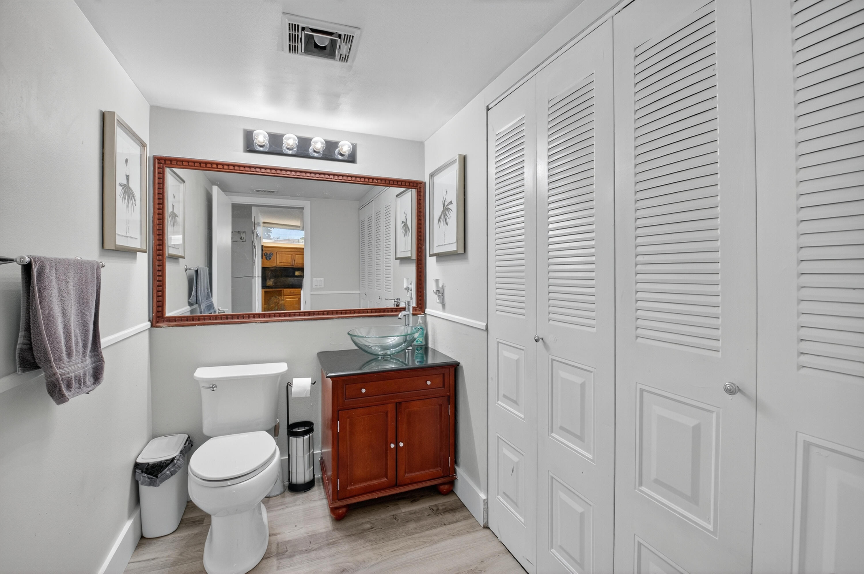 8200 Thames Boulevard, Unit C Boca Raton, FL 33433 - Photo 23 of 45 a bathroom with a toilet sink and mirror