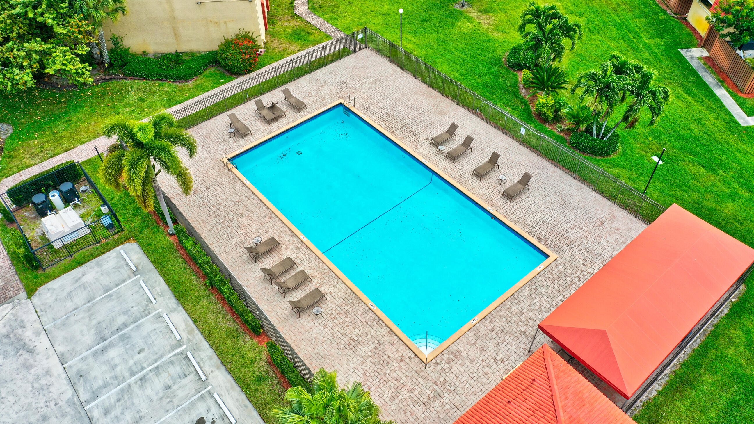 8200 Thames Boulevard, Unit C Boca Raton, FL 33433 - Photo 28 of 45 a view of a backyard with a garden and deck