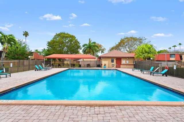 a view of swimming pool with seating space