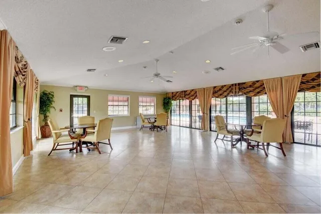 a lobby with furniture and floor to ceiling window