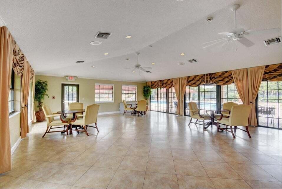 8200 Thames Boulevard, Unit C Boca Raton, FL 33433 - Photo 35 of 45 a lobby with furniture and floor to ceiling window