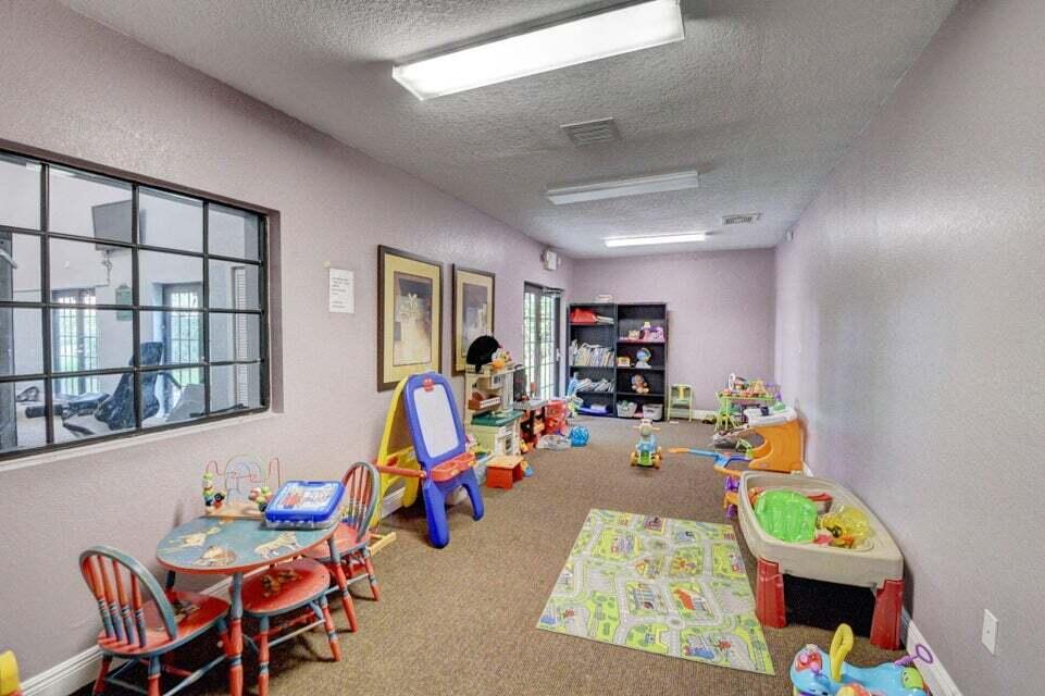 8200 Thames Boulevard, Unit C Boca Raton, FL 33433 - Photo 38 of 45 a bedroom with furniture and a wooden floor