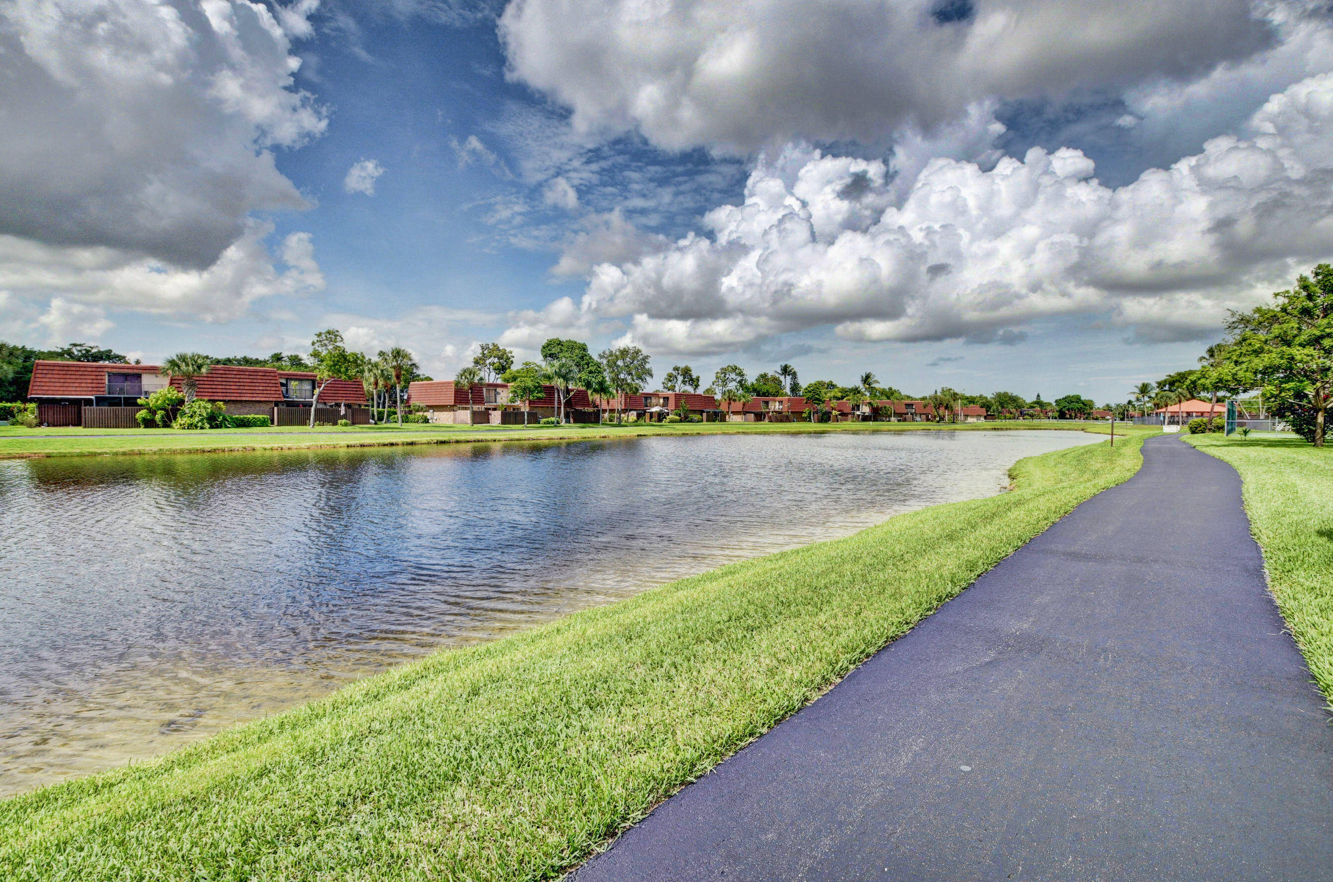 8200 Thames Boulevard, Unit C Boca Raton, FL 33433 - Photo 41 of 45 a view of a lake with houses in the back