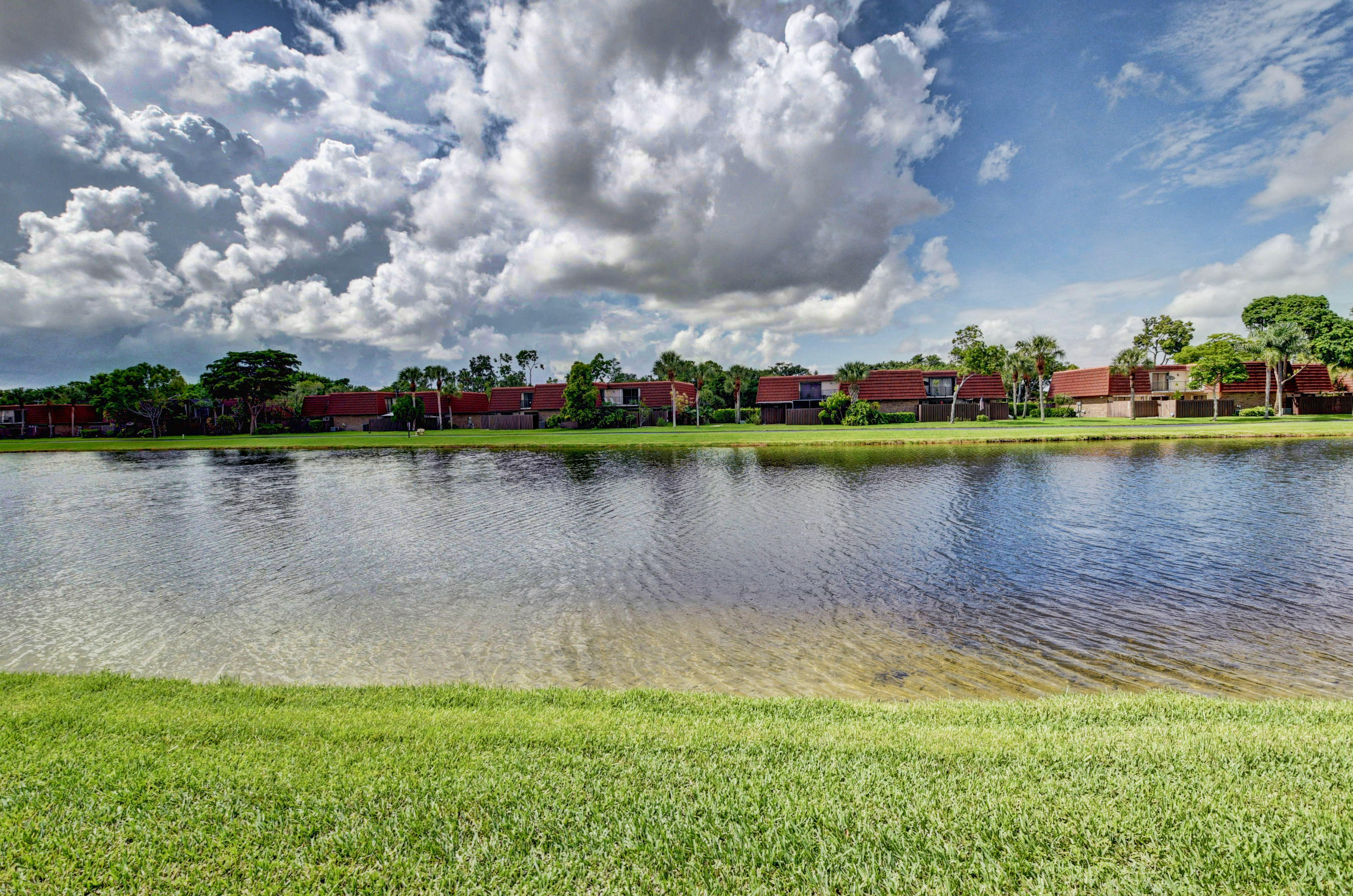 8200 Thames Boulevard, Unit C Boca Raton, FL 33433 - Photo 42 of 45 a view of a lake with houses in the back