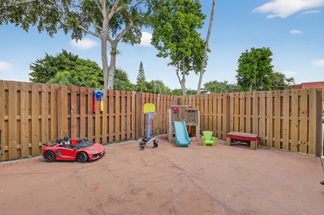a living room with furniture and large window