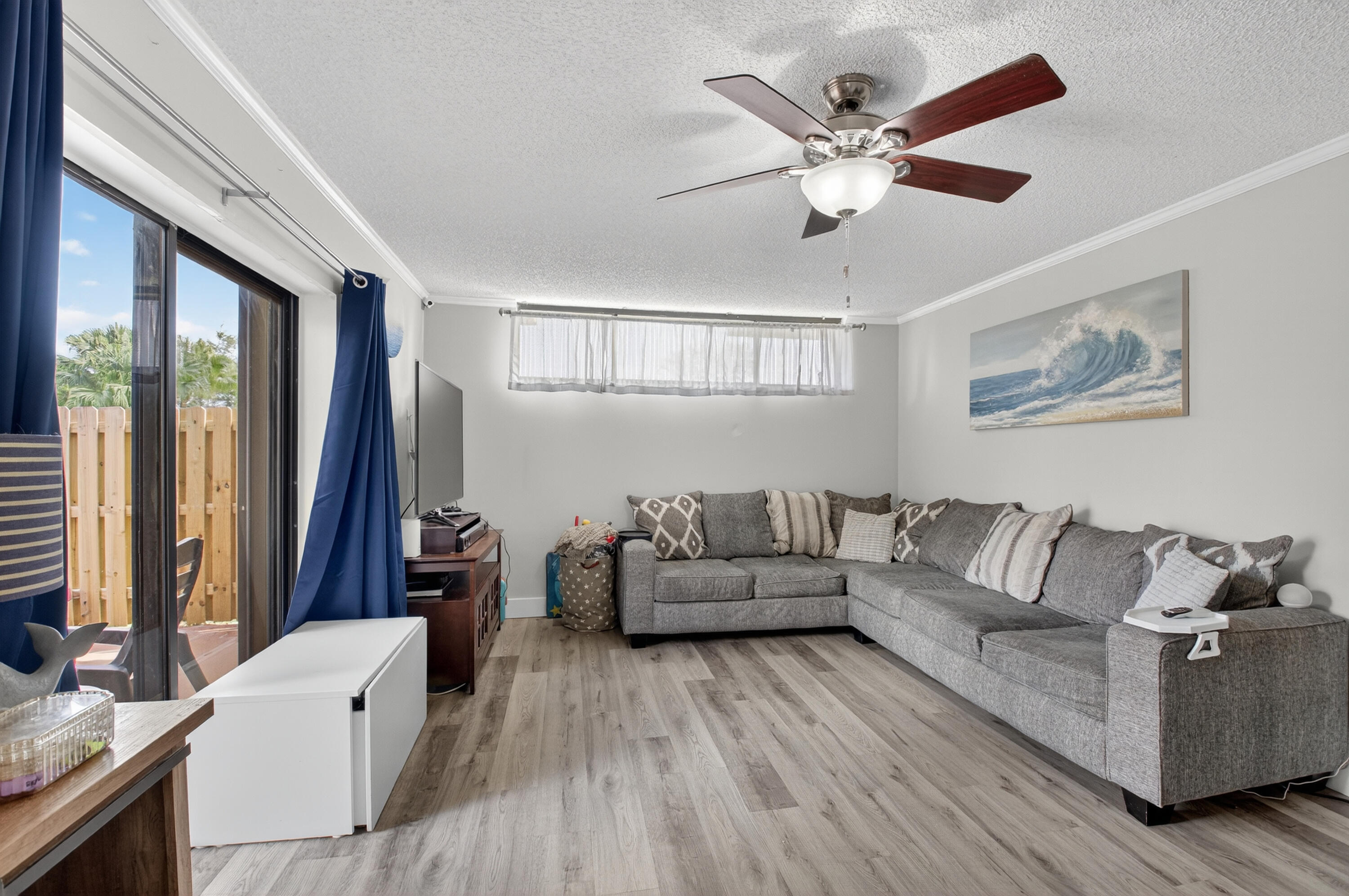 8200 Thames Boulevard, Unit C Boca Raton, FL 33433 - Photo 8 of 45 a living room with furniture and a large window