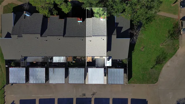 an aerial view of residential houses with outdoor space