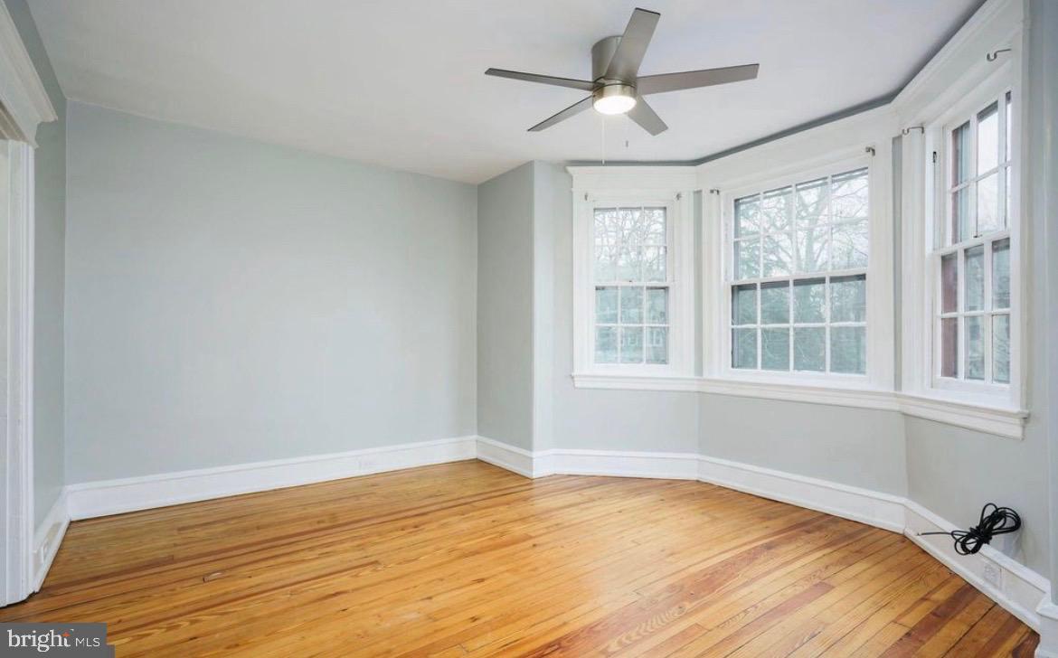 239 Kings Highway East, Unit B Haddonfield, NJ 08033 - Photo 2 of 14 a view of empty room with wooden floor and fan