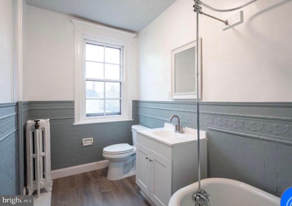 239 Kings Highway East, Unit B Haddonfield, NJ 08033 - Photo 6 of 14 a bathroom with a toilet sink and mirror