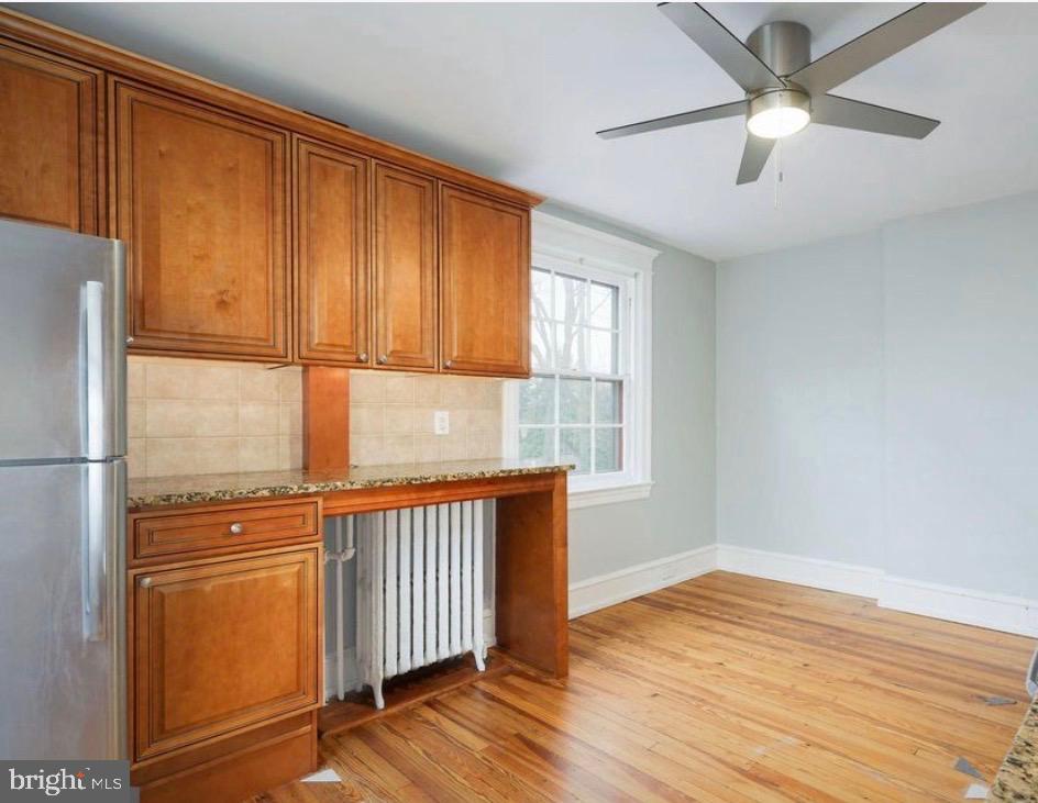 239 Kings Highway East, Unit B Haddonfield, NJ 08033 - Photo 8 of 14 a view of a room with wooden floor and a window