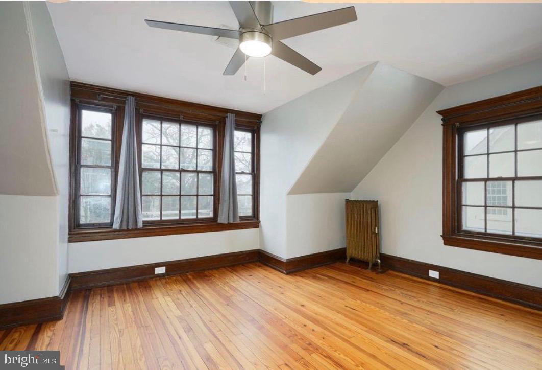 239 Kings Highway East, Unit B Haddonfield, NJ 08033 - Photo 9 of 14 an empty room with wooden floor and windows