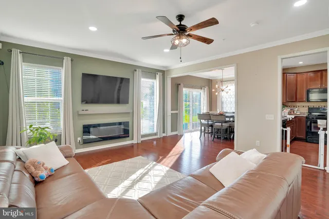 a living room with furniture fireplace and a flat screen tv