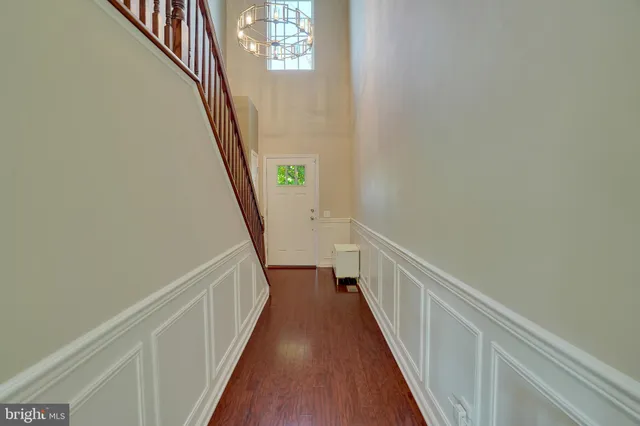 a view of a hallway with stairs